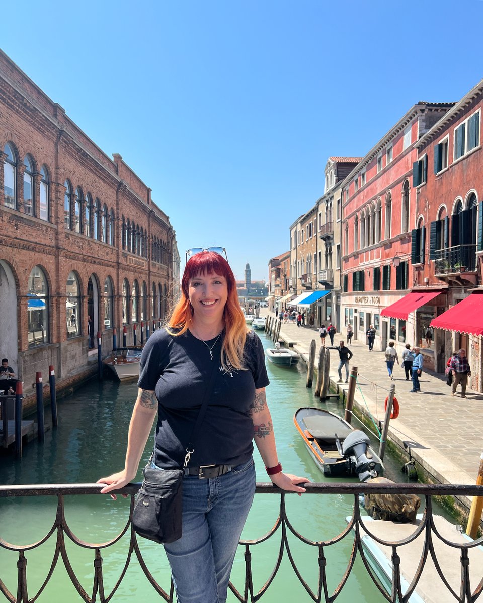 Adrianne standing on a bridge in Murano, Italy